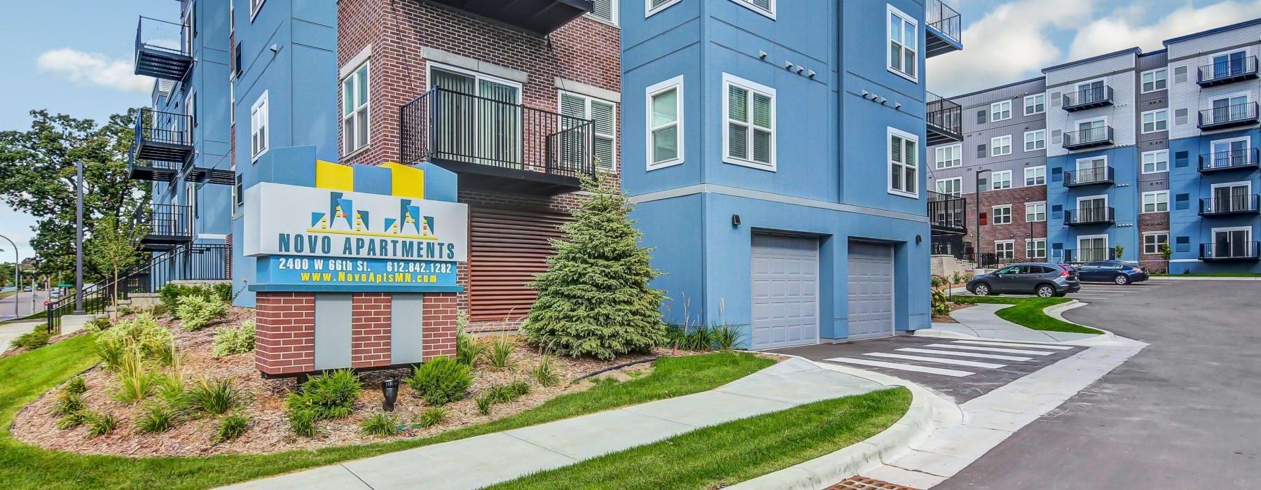 an entrance to a row of multi-story buildings