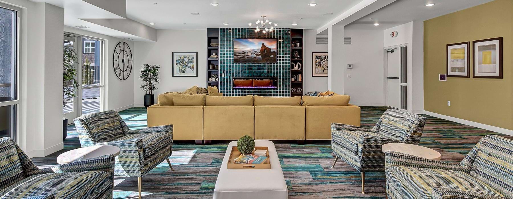 a lounge with a television and seating