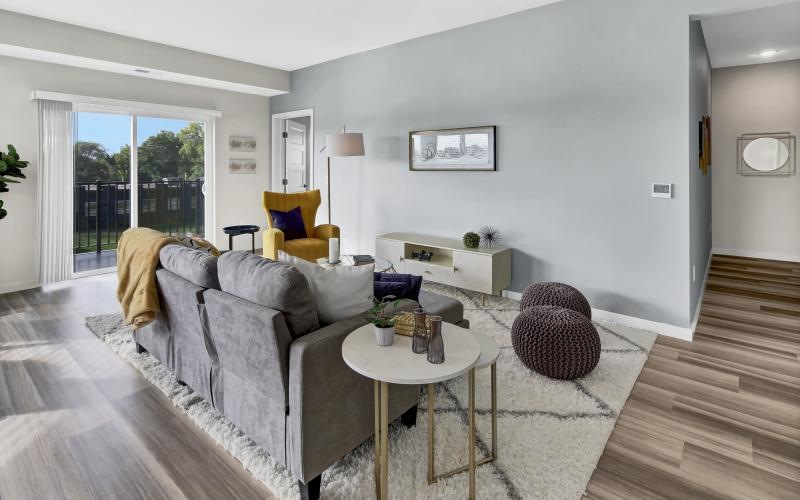a living room with a couch and tables